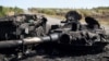 Ukraine -- A destroyed tank is seen on the road to Ilovaisk, 50 kms east of Donetsk on September 3, 2014.